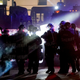 Riot police clearing a square in Kenosha, Wisconsin, where an armed group calling itself the Kenosha Guard organized on Facebook to confront Black Lives Matter protesters before a vigilante killed two and wounded another. The Kenosha Guard is now on Facebook's Dangerous Individuals and Organizations list.